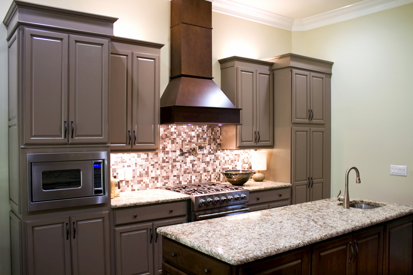Modern kitchen with stove, oven, and sink