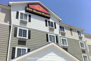House exterior with 'Call Boo Value Place' signage